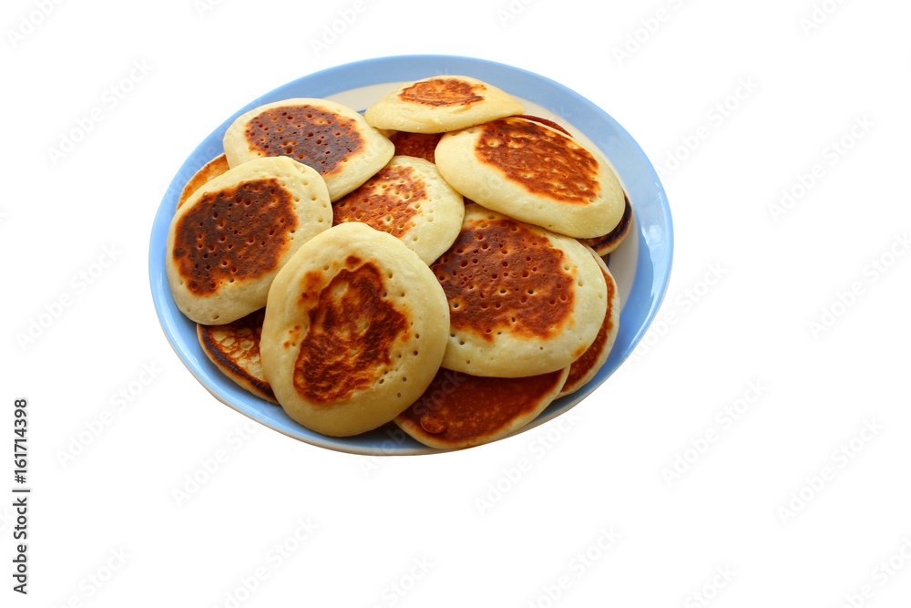 Fritters. Beautiful pancakes made of cheese in curd, fritters, a traditional dish of Russia and Ukraine. Fritters. Beautiful pancakes made of cheese in curd, fritters, a traditional dish of Russia and Ukraine.