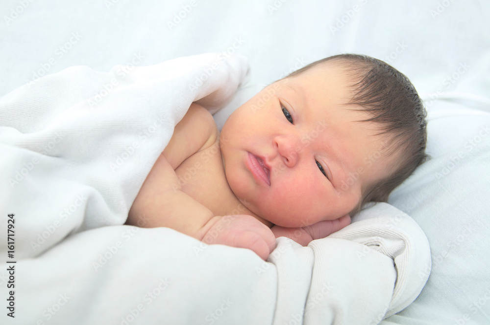 Newborn jaundice, baby portrait in blanket Newborn jaundice, baby portrait in blanket