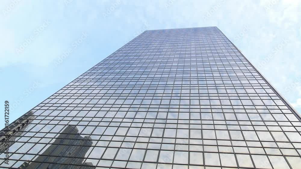 Modern Skyscraper in Business District Against Blue Sky. HD, 1920x1080. Modern Skyscraper in Business District Against Blue Sky. HD, 1920x1080.