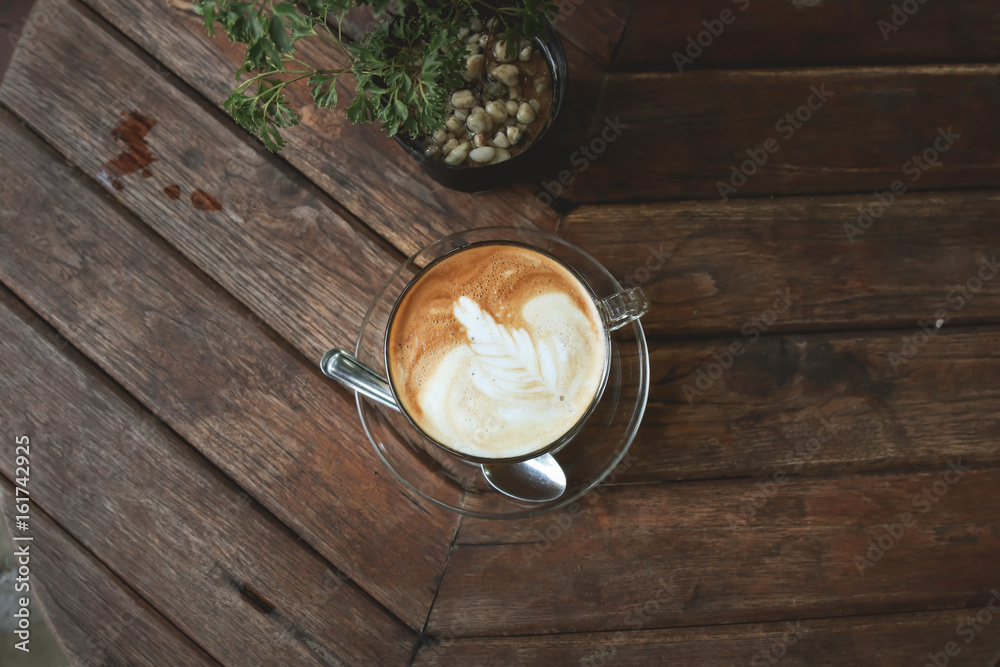 Latte with leaf frothy foam Latte with leaf frothy foam