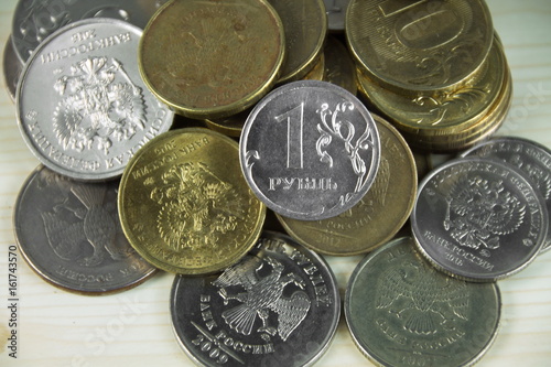 российский рубль на фоне монет photo