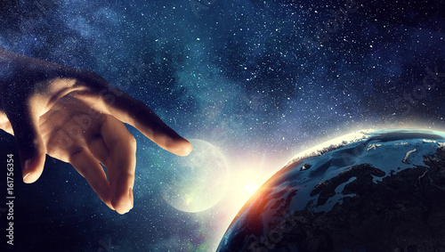 Touching planet with finger