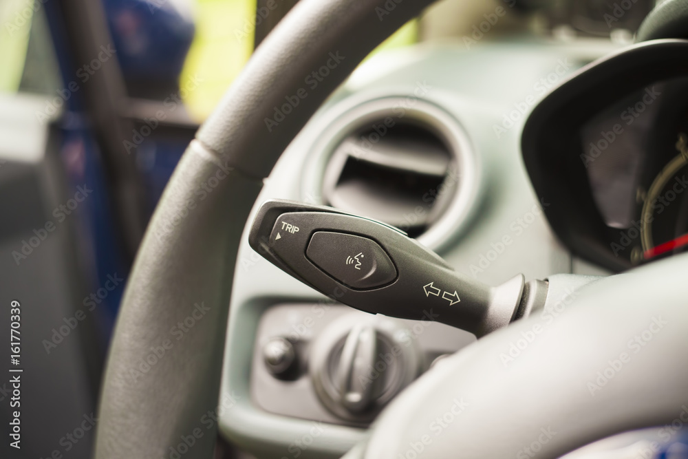 closeup of interior car knob on dashboard