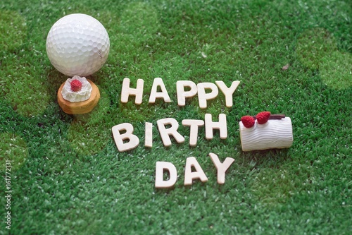 Happy birthday alphabet with golf ball are on green course