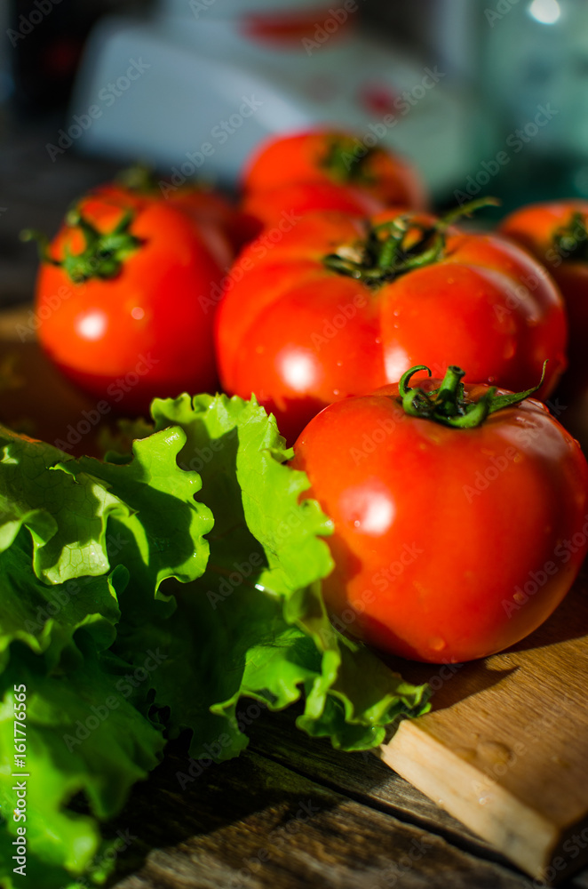 Ripe tomatoes on a cutting Board