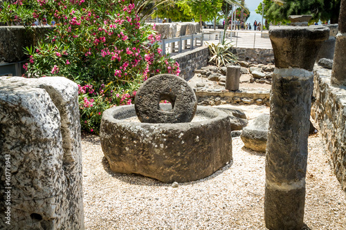 Ancient millstone for olive oil press in Capernaum, Israel