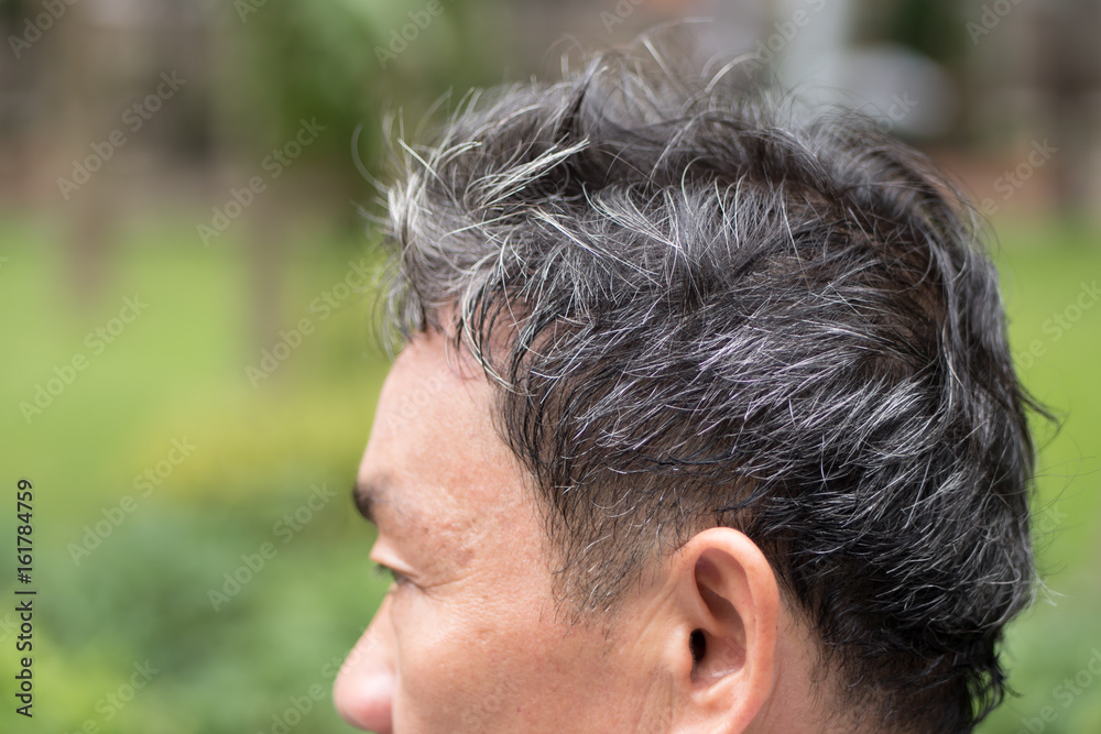 Fototapeta premium old senior or middle aged man with grey hair problem