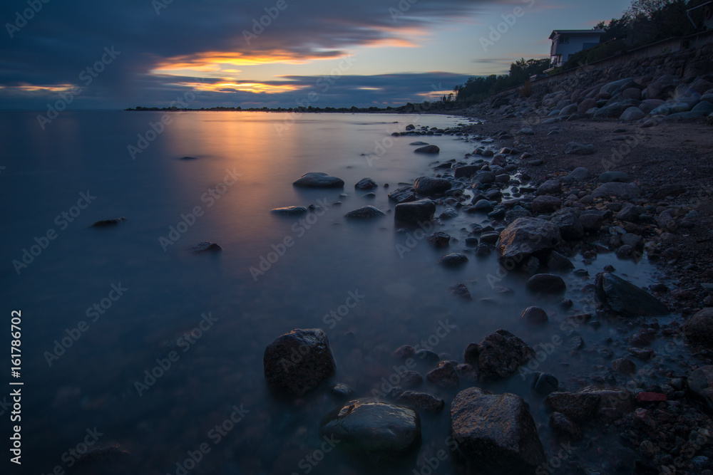 View of the house at the coast after sunset on the Gulf of Finland