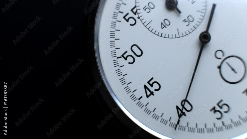 Video showing close-up Stopwatch. Clock on a dark background Video showing close-up Stopwatch. Clock on a dark background