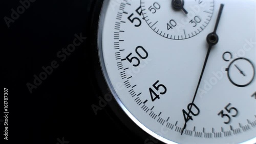 Video showing close-up Stopwatch. Clock on a dark background
