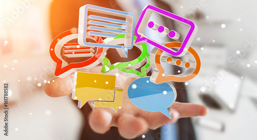 Businessman using digital colorful 3D rendering conversation icons