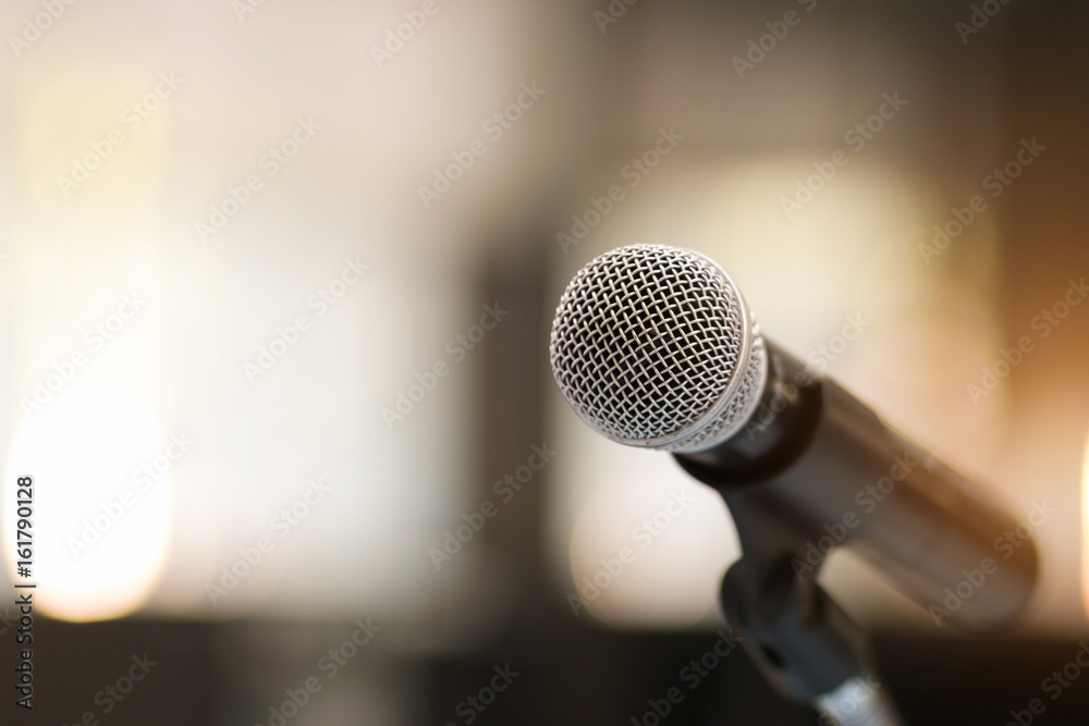 Close up of classic microphone on note stand in bokeh background Close up of classic microphone on note stand in bokeh background