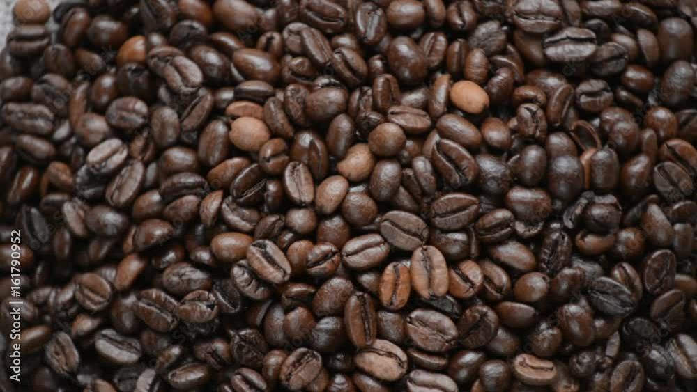 The coffee beans rotates on the turntable. The coffee beans rotates on the turntable.