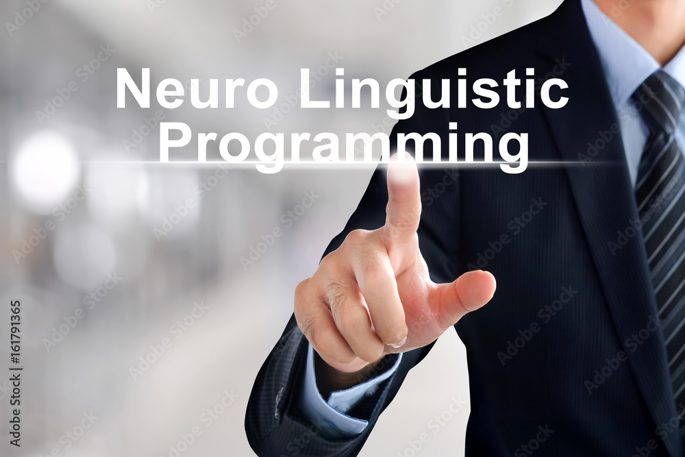 Businessman hand touching Neuro Linguistic Programming (or NLP) sign virtual screen Businessman hand touching Neuro Linguistic Programming (or NLP) sign virtual screen