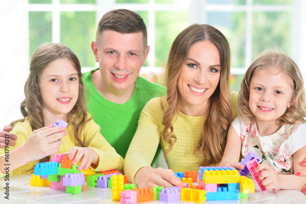 Family collecting blocks together Family collecting blocks together
