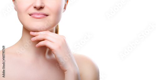 Portrait of girl with nude make-up with hands on chin isolated on white background, free space for text. Girl with clean healthy skin on white, copy space. Beauty model isolated on white