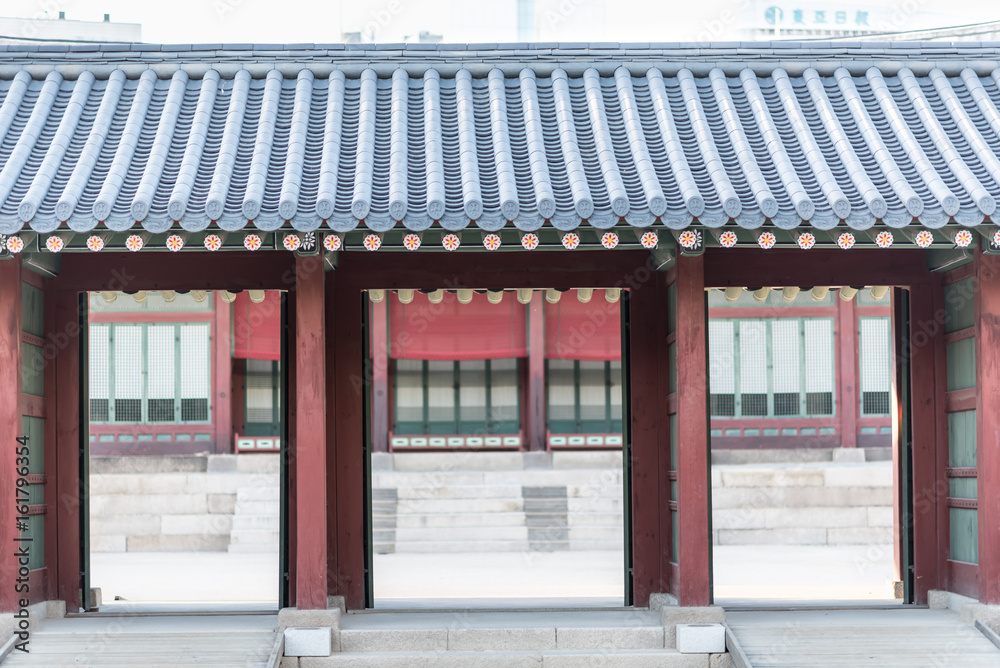 Korean traditional architecture - Korean Tradition Wooden Gate and red outdoor stone wall, decoration brick wall from ancient korean, Bukchon is unique place in Seoul, republic of Korea / south korea