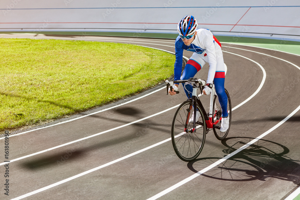 Naklejka premium Racing cyclist on velodrome outdoor.