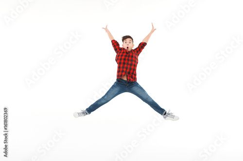 Expressive happy boy in jumping