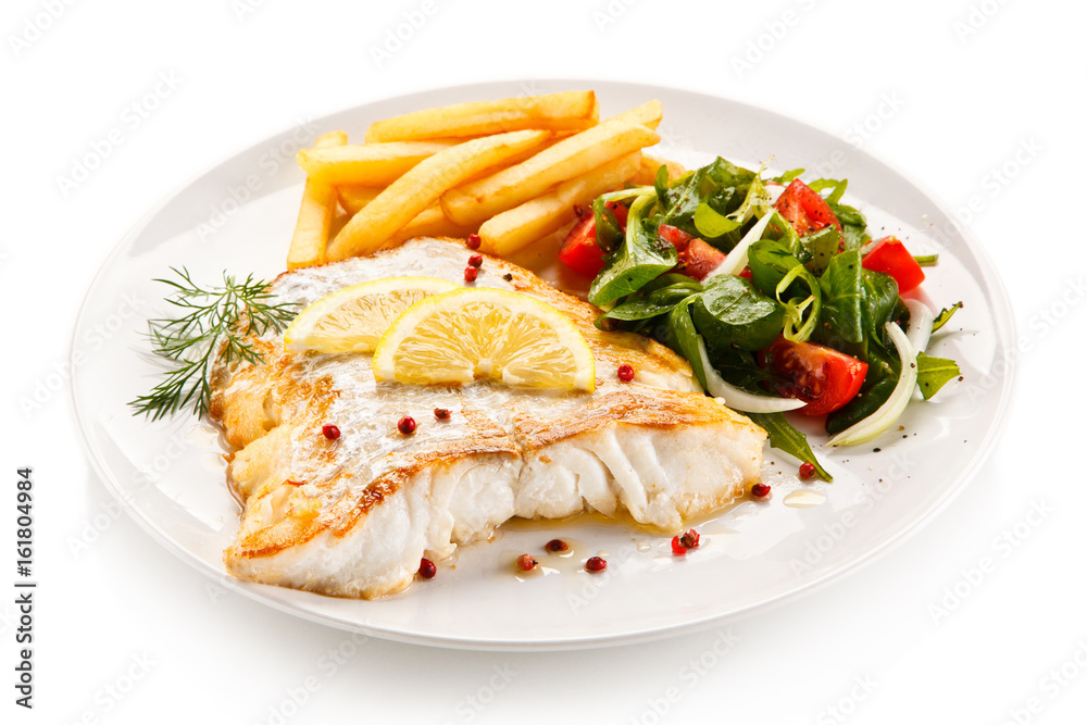 Fish dish - fried fish fillet and vegetables Fish dish - fried fish fillet and vegetables
