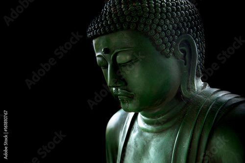 zen style buddha with light of wisdom black and white, peaceful asian buddha tao religion art style statue.