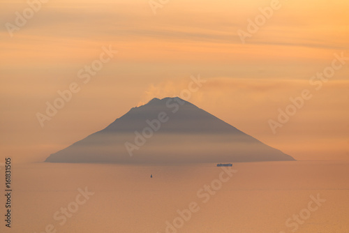 Active volcano Stromboli view at sunrise sunset from Salina Eolian island in Sicily Italy in summer