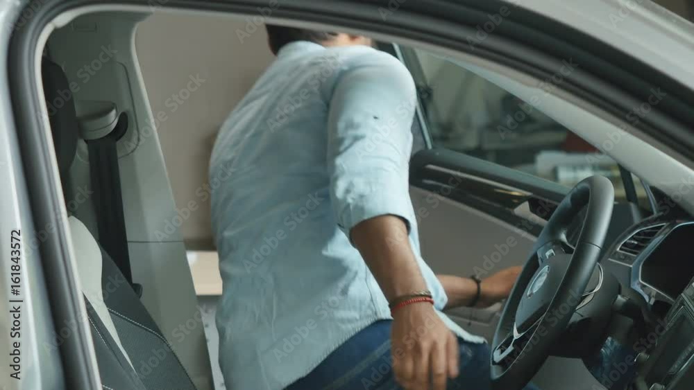 Portrait of a swarthy man getting out of the car Portrait of a swarthy man getting out of the car