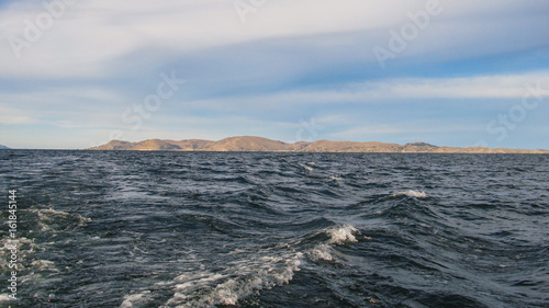 A view from the boat of Lake Titicaca in Puno, Peru © Helissa