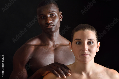 portrait of a couple mixed race on black