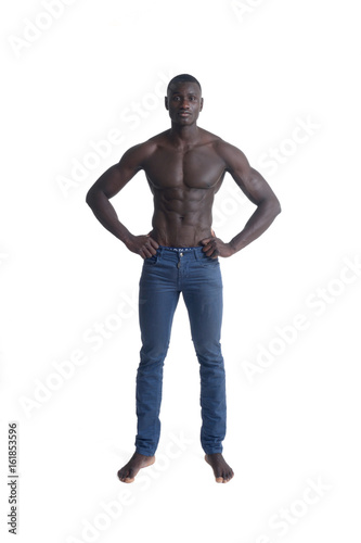 Portrait of african man with jeans and on white photo