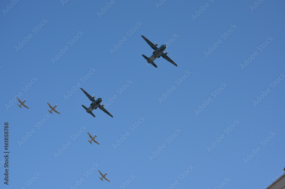 A group of Two Fixed Wing Aircrafts and Four Gray Fighter Aircrafts Going Together Upwards A group of Two Fixed Wing Aircrafts and Four Gray Fighter Aircrafts Going Together Upwards