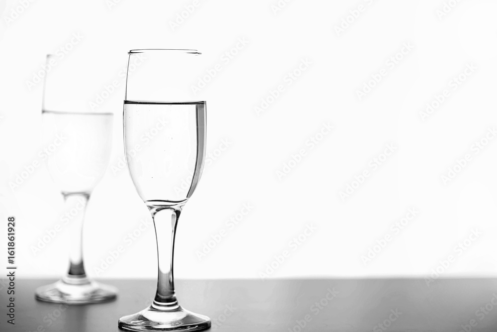 monochrome photo of champagne on white table on white background isolate monochrome photo of champagne on white table on white background isolate