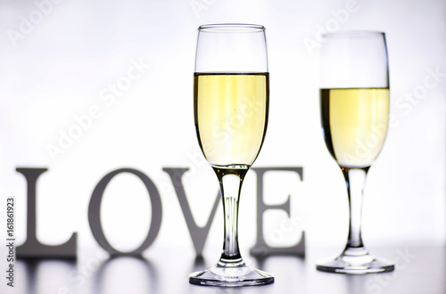 glass of white wine on a table on white background isolate