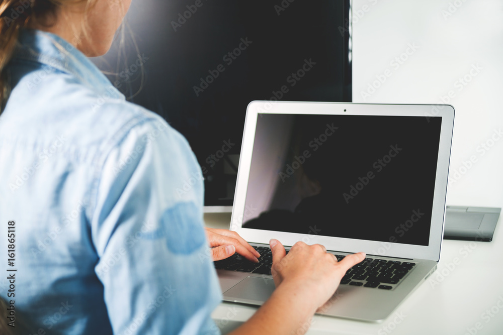 Woman working on laptop at home office desk freelance concept Woman working on laptop at home office desk freelance concept