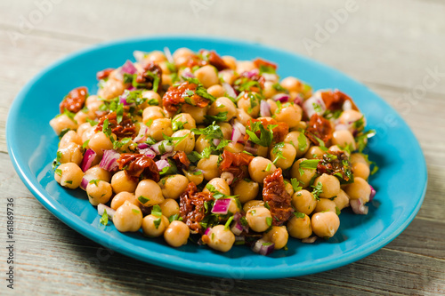 Chickpeas salad with onion and dried tomatoes.