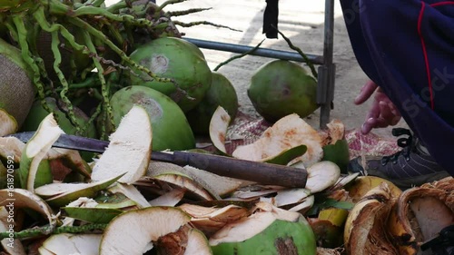 Time lapse man cutting coconut