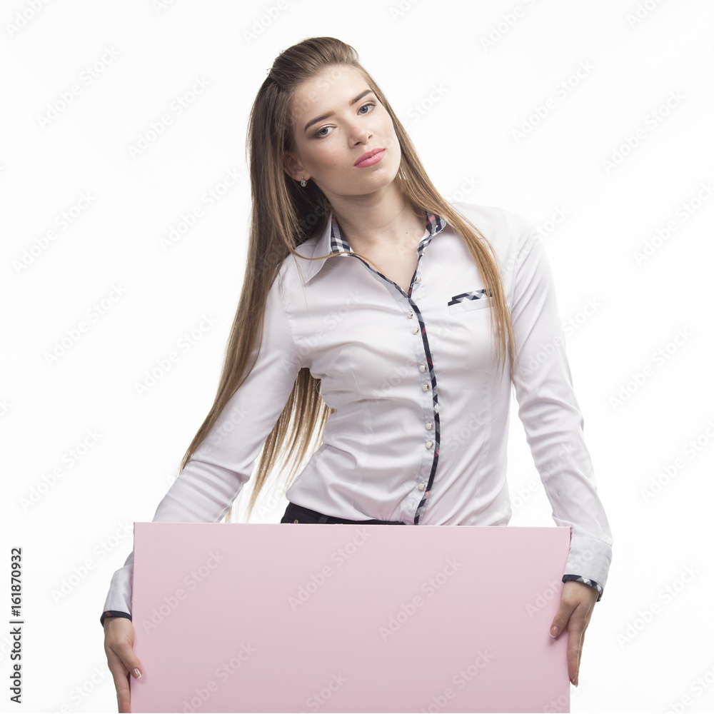 Young sexy woman portrait of a confident businesswoman showing presentation, pointing placard gray background. Ideal for banners, registration forms, presentation, landings, presenting concept.. Young sexy woman portrait of a confident businesswoman showing presentation, pointing placard gray background. Ideal for banners, registration forms, presentation, landings, presenting concept..