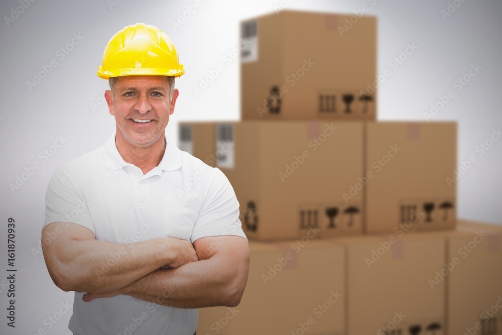 Composite 3d image of worker wearing hard hat in warehouse Composite 3d image of worker wearing hard hat in warehouse