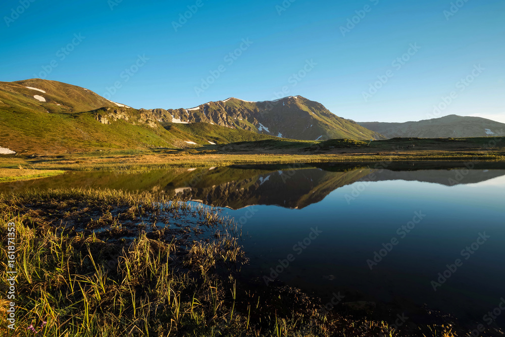 Mountain alpine lake panorama landscape view in Carpathians, Romania