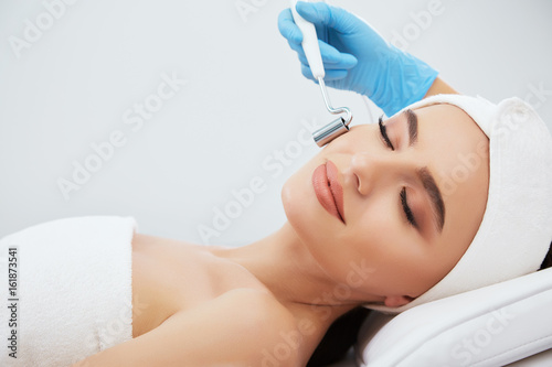 Cute girl doing cosmetic procedure