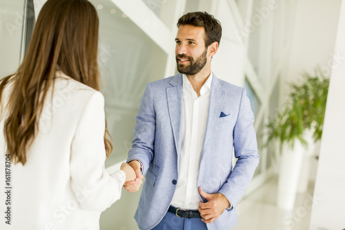 Smiling young businessman m...