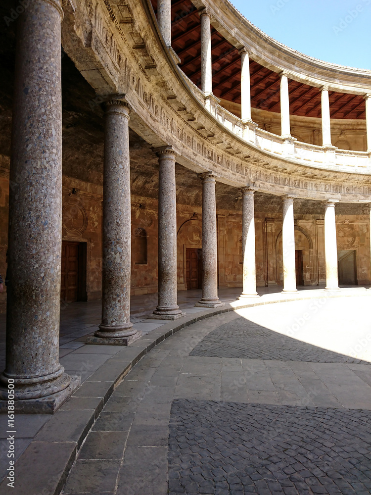 Inner corridors of courtyard of Palace of Charles V at Alhambra fortress in Granada,