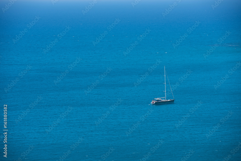 Alone yacht sailing in open sea