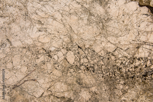 Background quarried rough textured limestone rock