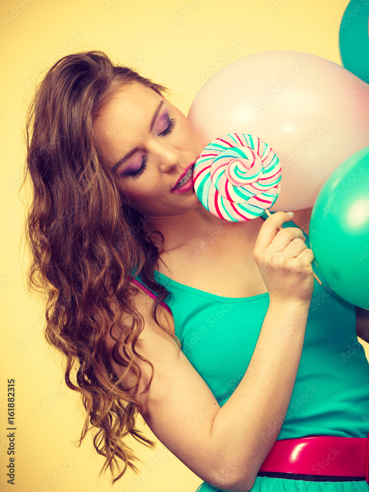 Woman with colorful balloons and lollipop Woman with colorful balloons and lollipop