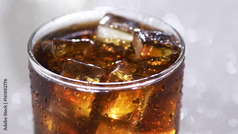 Coke with ice cubes background. Rotation 360 degrees. 4K UHD video 3840X2160 Coke with ice cubes background. Rotation 360 degrees. 4K UHD video 3840X2160