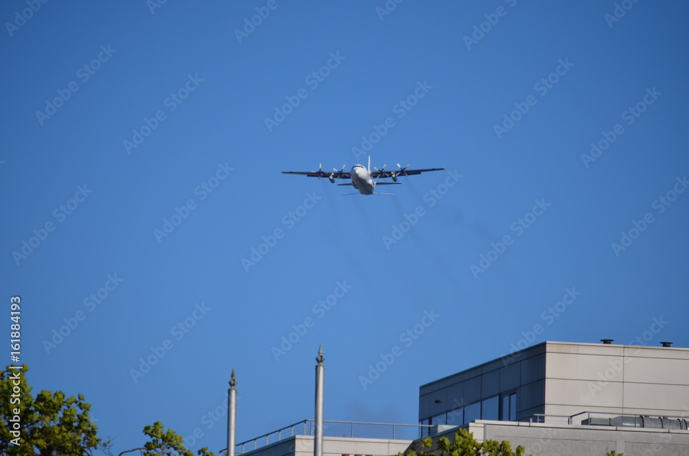 Military Four Helix Aircraft Flying in Low Altitude Military Four Helix Aircraft Flying in Low Altitude