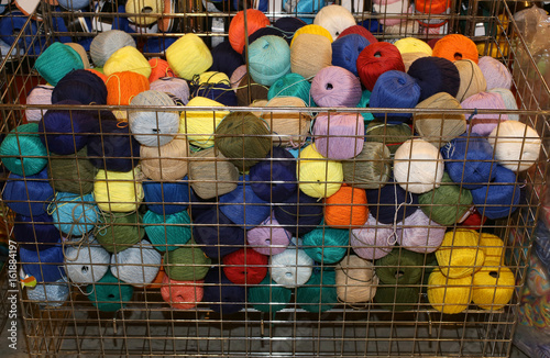 Bilde på lerret Basket full of woolen yarns for sale in wholesale haberdashery