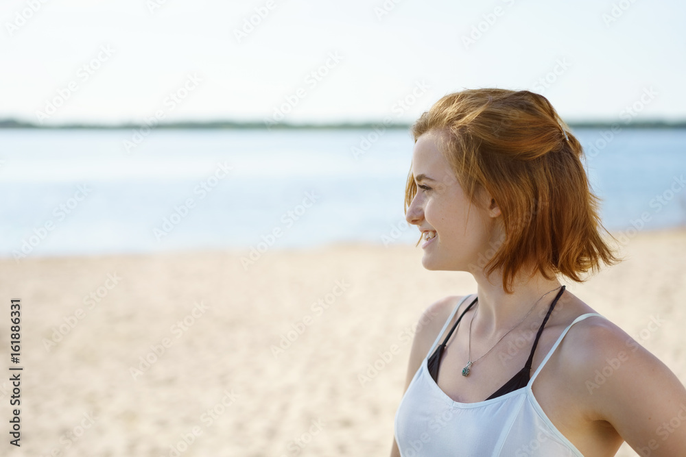 Pretty young woman standing watching something Pretty young woman standing watching something