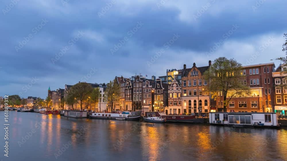 Amsterdam city skyline day to night timelapse at canal waterfront, Amsterdam, Netherlands, 4K Time Lapse